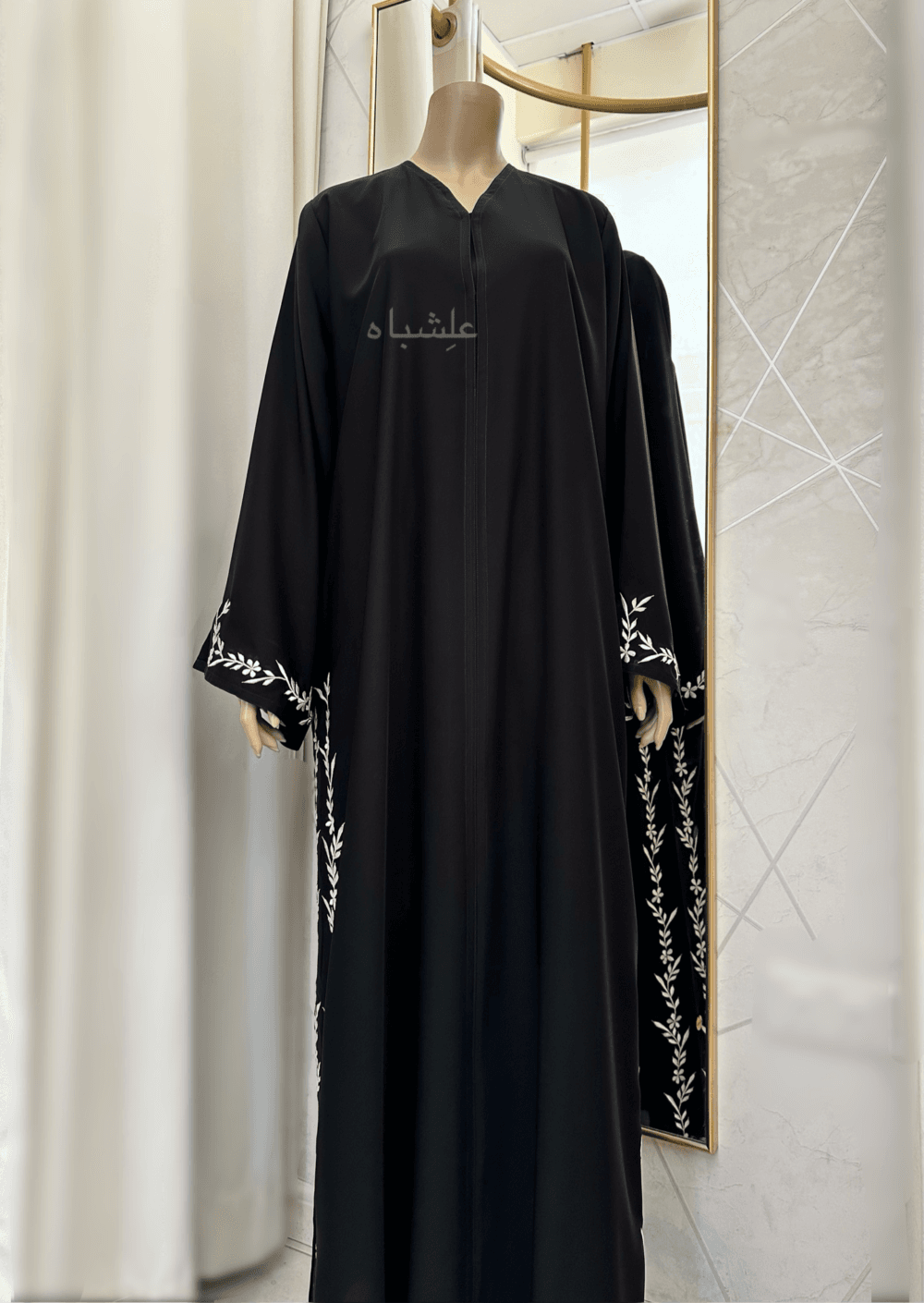 Abaya featuring premium Nida fabric with intricate floral embroidery woven with zari thread, complemented by a luxurious khimar made of Almas fabric. The Alishbah Salafi Khimar Abaya blends timeless elegance with contemporary design, offering sophistication and grace.