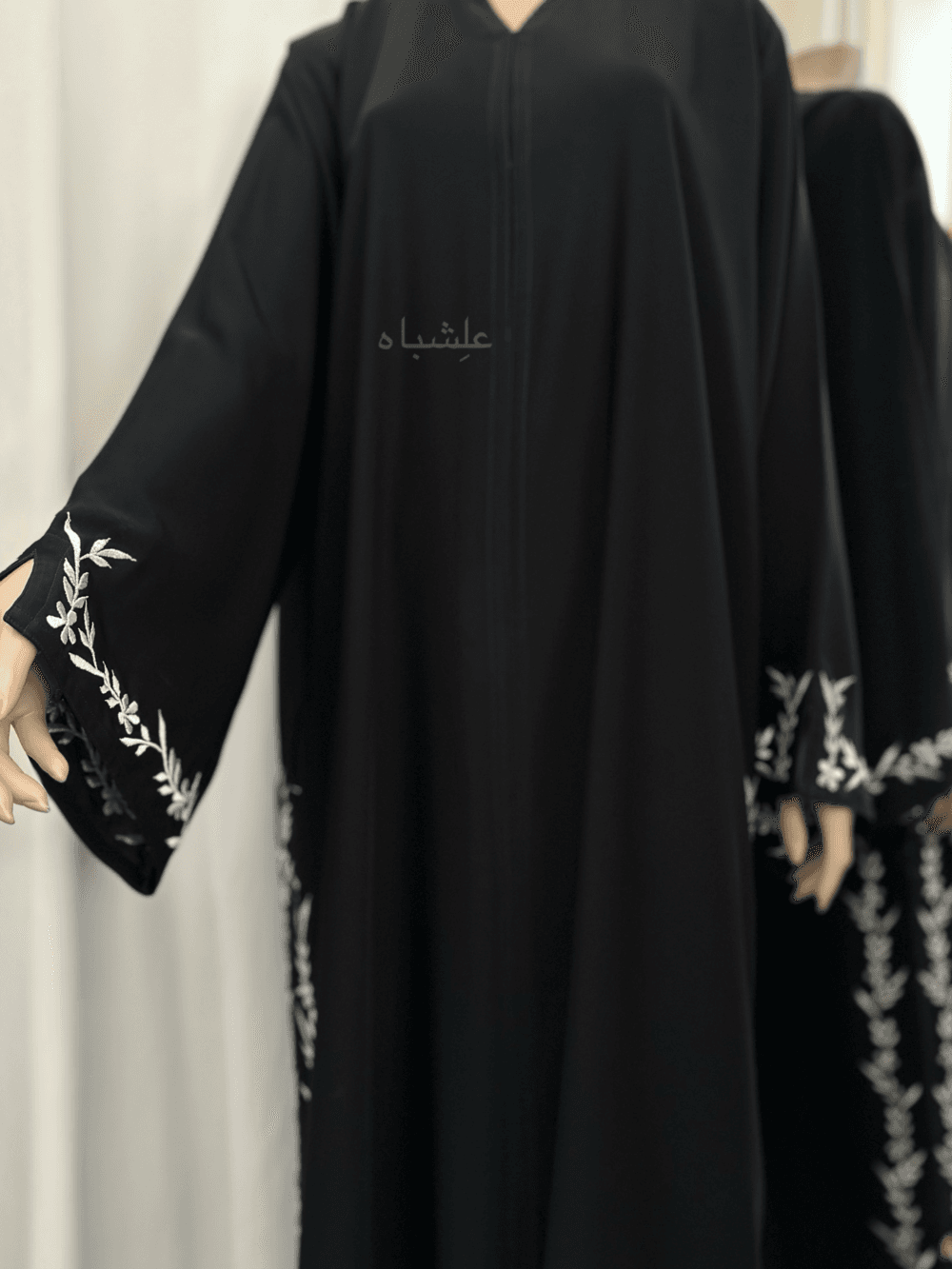 Abaya featuring premium Nida fabric with intricate floral embroidery woven with zari thread, complemented by a luxurious khimar made of Almas fabric. The Alishbah Salafi Khimar Abaya blends timeless elegance with contemporary design, offering sophistication and grace.