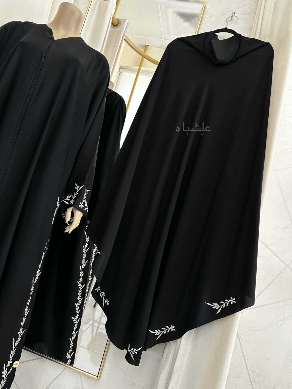 Abaya featuring premium Nida fabric with intricate floral embroidery woven with zari thread, complemented by a luxurious khimar made of Almas fabric. The Alishbah Salafi Khimar Abaya blends timeless elegance with contemporary design, offering sophistication and grace.