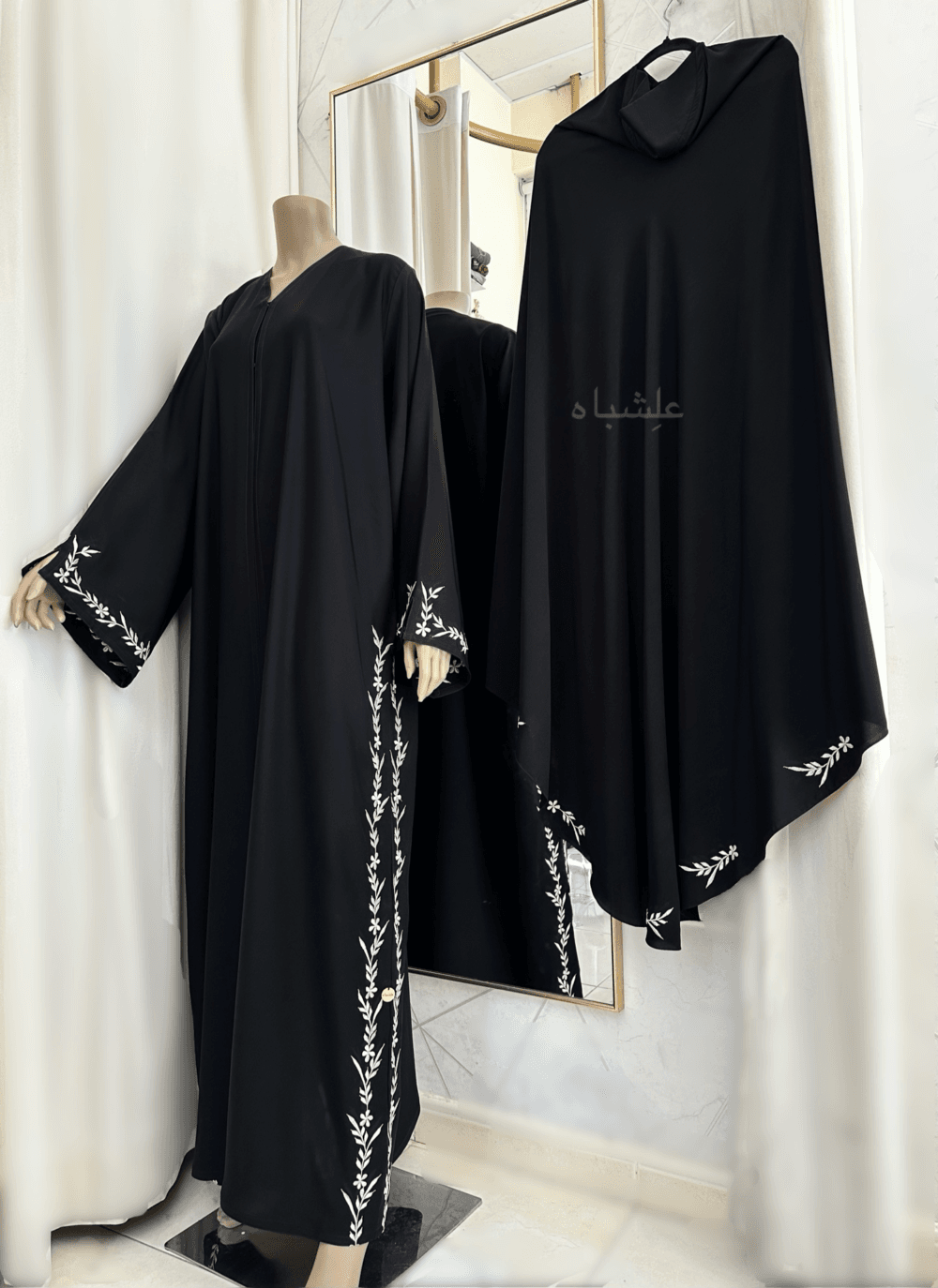 Abaya featuring premium Nida fabric with intricate floral embroidery woven with zari thread, complemented by a luxurious khimar made of Almas fabric. The Alishbah Salafi Khimar Abaya blends timeless elegance with contemporary design, offering sophistication and grace.