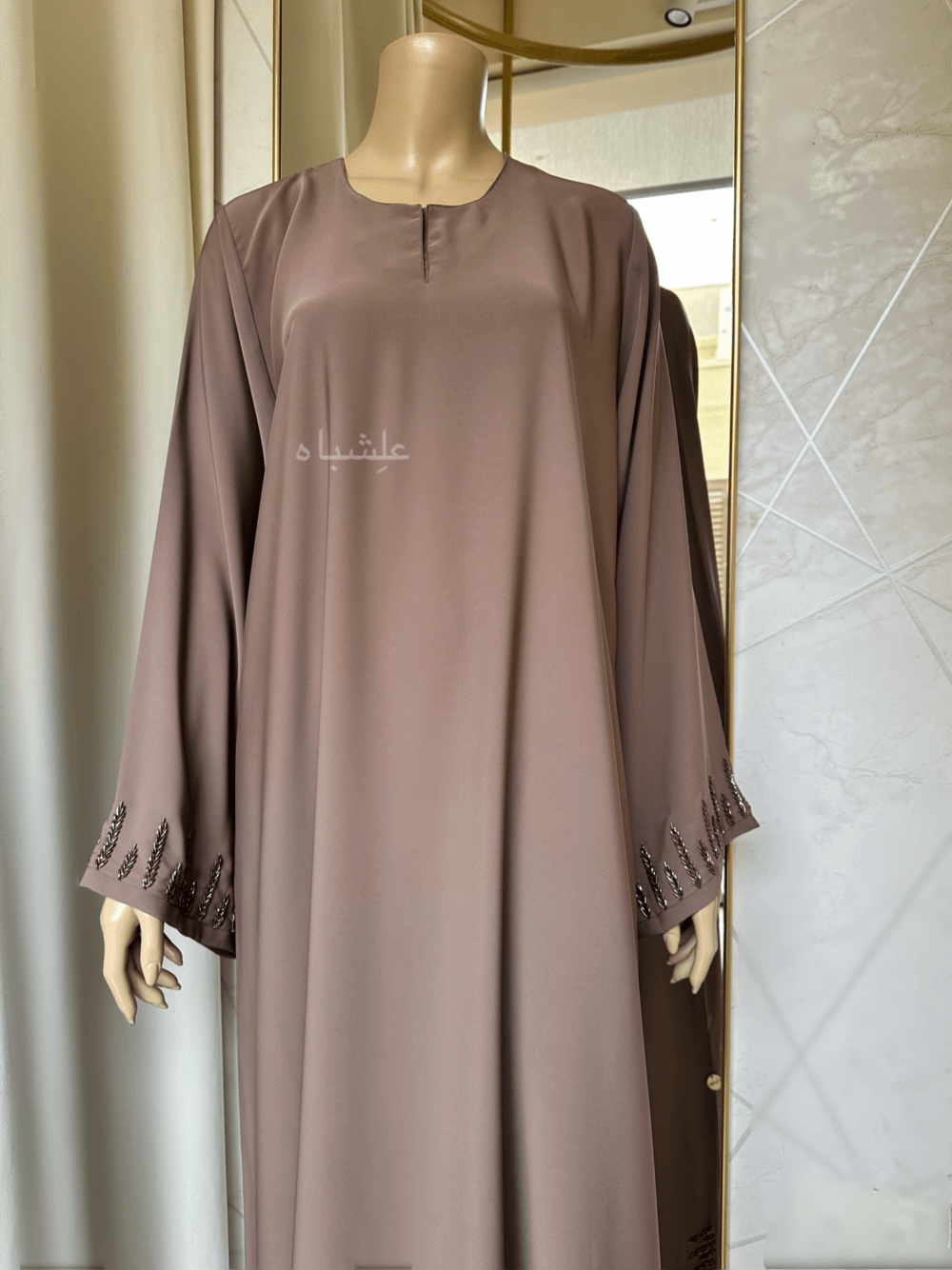 Abaya featuring delicate handwork embellishments on the sleeves and slits, crafted from high-quality materials. The Alishbah Pink Abaya blends timeless elegance with modern sophistication, suitable for both formal and casual occasions."