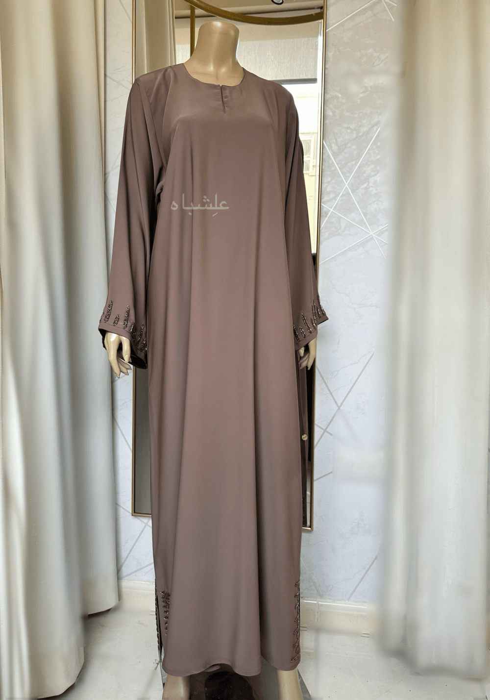 Abaya featuring delicate handwork embellishments on the sleeves and slits, crafted from high-quality materials. The Alishbah Pink Abaya blends timeless elegance with modern sophistication, suitable for both formal and casual occasions."