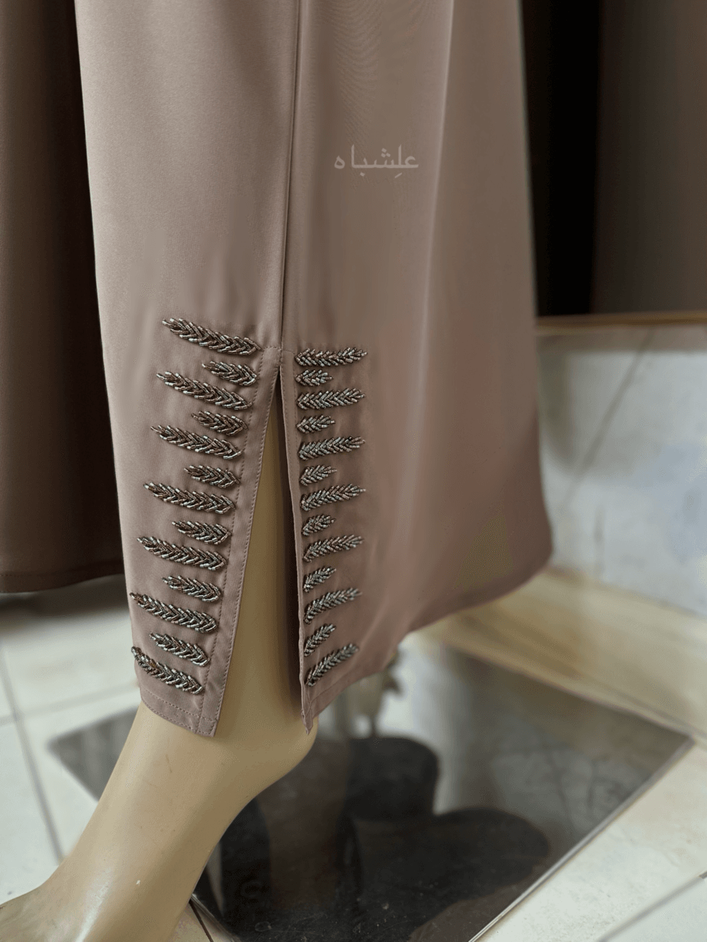 Abaya featuring delicate handwork embellishments on the sleeves and slits, crafted from high-quality materials. The Alishbah Pink Abaya blends timeless elegance with modern sophistication, suitable for both formal and casual occasions."