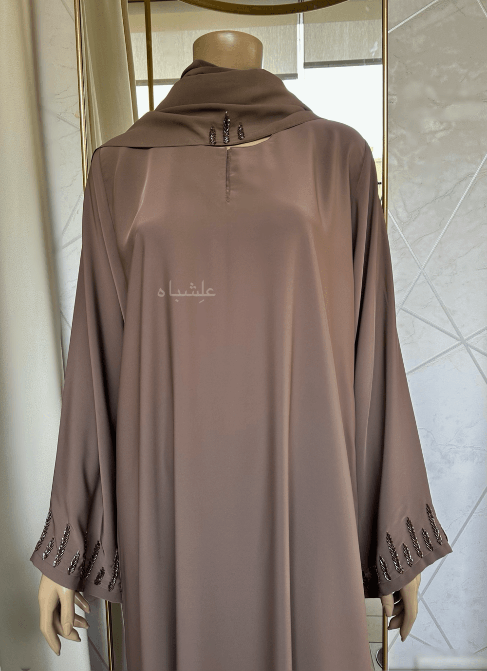 Abaya featuring delicate handwork embellishments on the sleeves and slits, crafted from high-quality materials. The Alishbah Pink Abaya blends timeless elegance with modern sophistication, suitable for both formal and casual occasions."