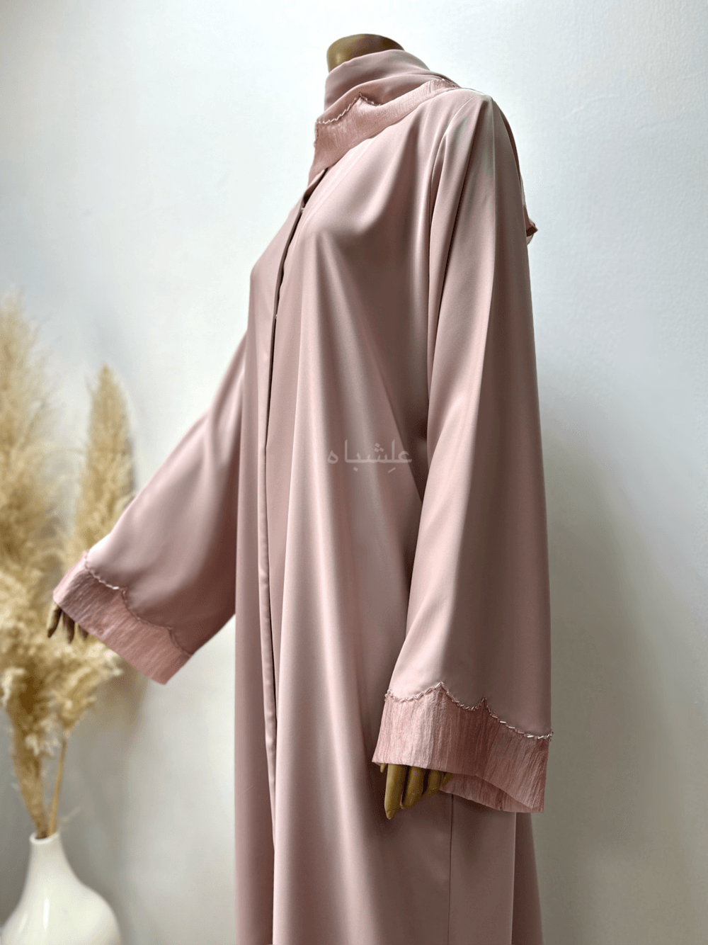 Abaya in pastel pink featuring delicate organza fabric and intricate tube work detailing. The Pastel Pink Abaya by Alishbah offers timeless elegance and sophistication, perfect for both formal events and everyday wear.