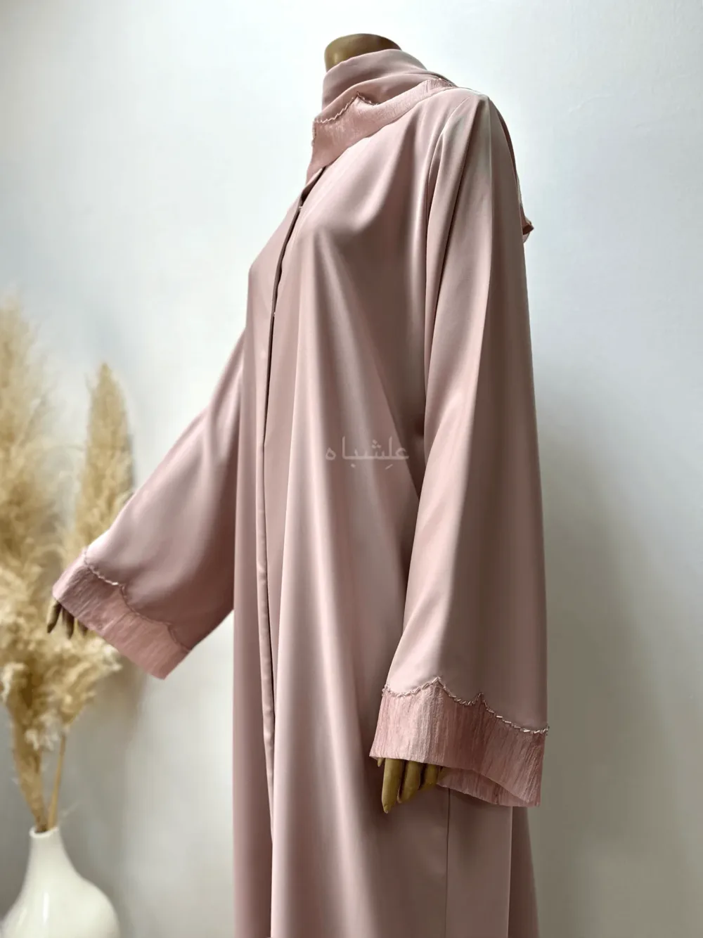 Abaya in pastel pink featuring delicate organza fabric and intricate tube work detailing. The Pastel Pink Abaya by Alishbah offers timeless elegance and sophistication, perfect for both formal events and everyday wear.
