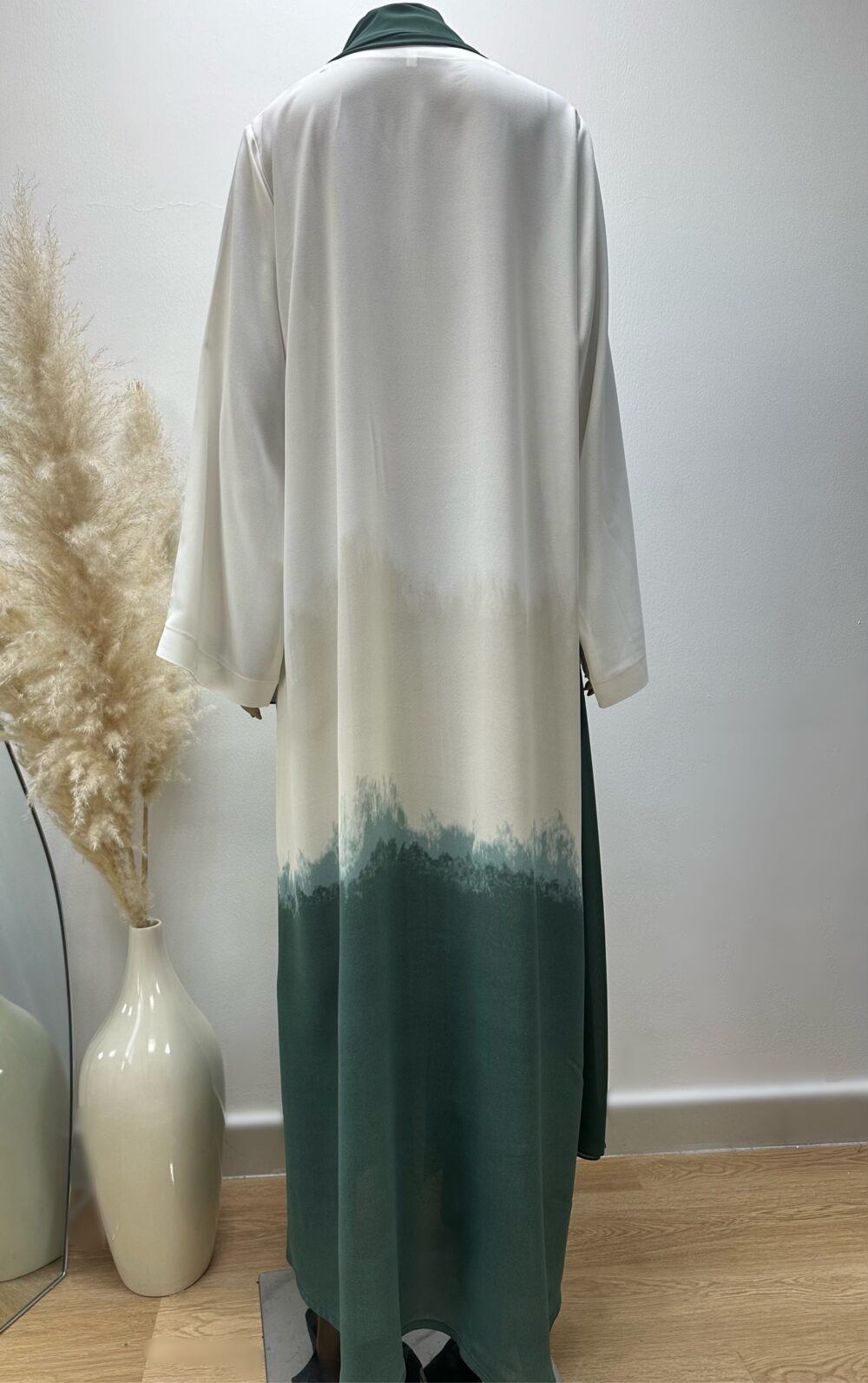 "Back view of the Ombré Abaya by Alishbah, highlighting the elegant gradient color transition from light to dark hues. The luxurious fabric drapes smoothly, creating a graceful, flowing silhouette. The design emphasizes the sophisticated and versatile nature of the abaya."