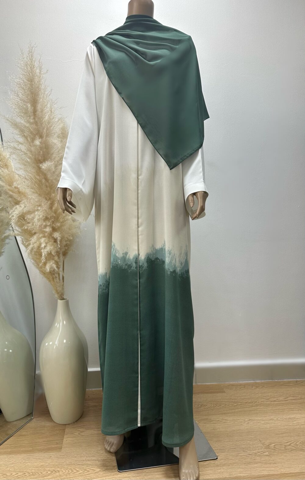 "Full front view of the Ombré Abaya by Alishbah, featuring a stunning gradient color transition from light to dark hues. The abaya's luxurious fabric flows gracefully, highlighting its elegant silhouette and versatile design. The Sheila is styled open, completing the sophisticated look."