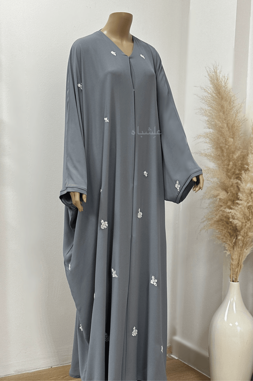 "Egyptian Crape Abaya by Alishbah with Farasha pattern, featuring wide, billowing sleeves that mimic butterfly wings, crafted from lightweight crape fabric for elegant and graceful movement."