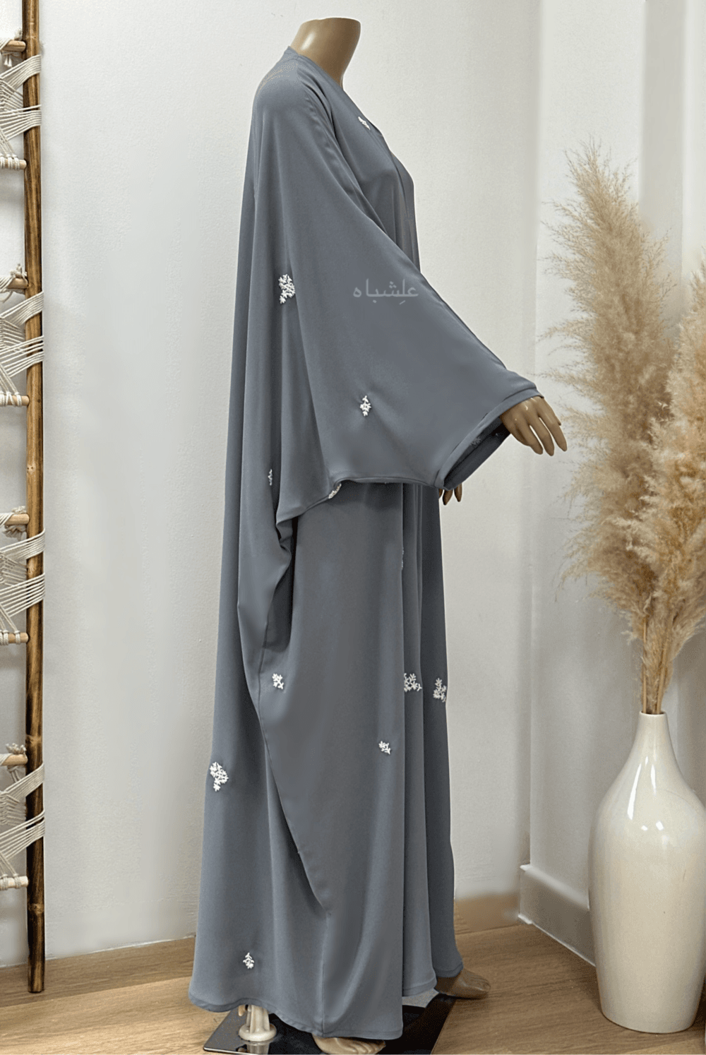 "Egyptian Crape Abaya by Alishbah with Farasha pattern, featuring wide, billowing sleeves that mimic butterfly wings, crafted from lightweight crape fabric for elegant and graceful movement."