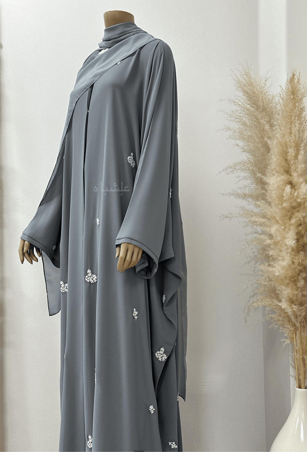 "Egyptian Crape Abaya by Alishbah with Farasha pattern, featuring wide, billowing sleeves that mimic butterfly wings, crafted from lightweight crape fabric for elegant and graceful movement."