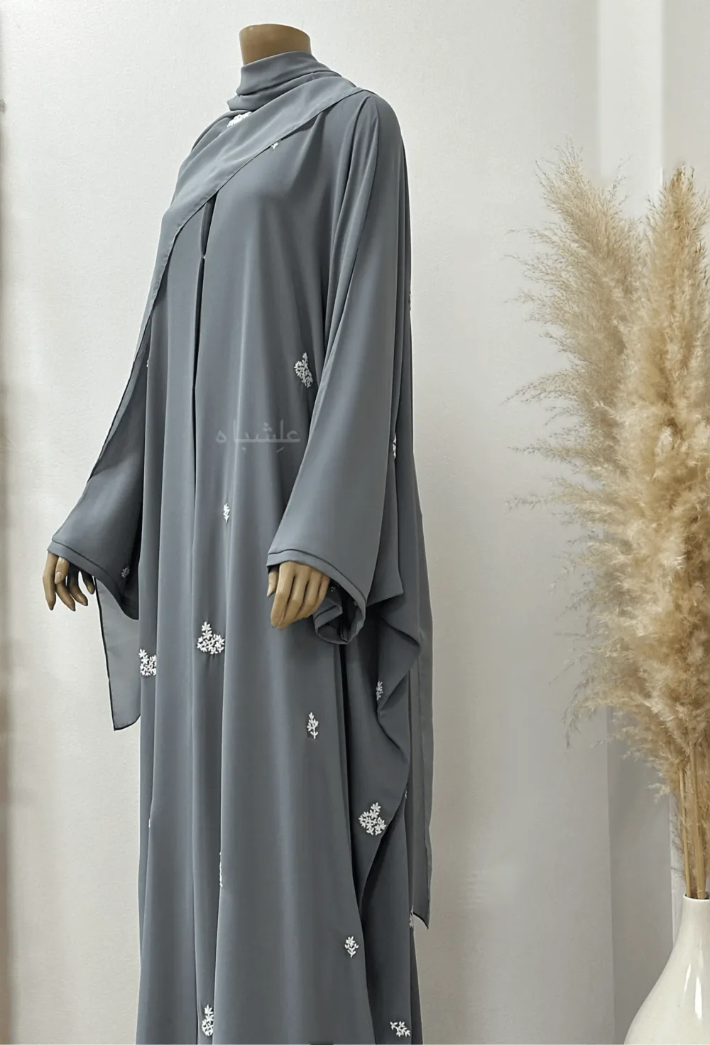 "Egyptian Crape Abaya by Alishbah with Farasha pattern, featuring wide, billowing sleeves that mimic butterfly wings, crafted from lightweight crape fabric for elegant and graceful movement."
