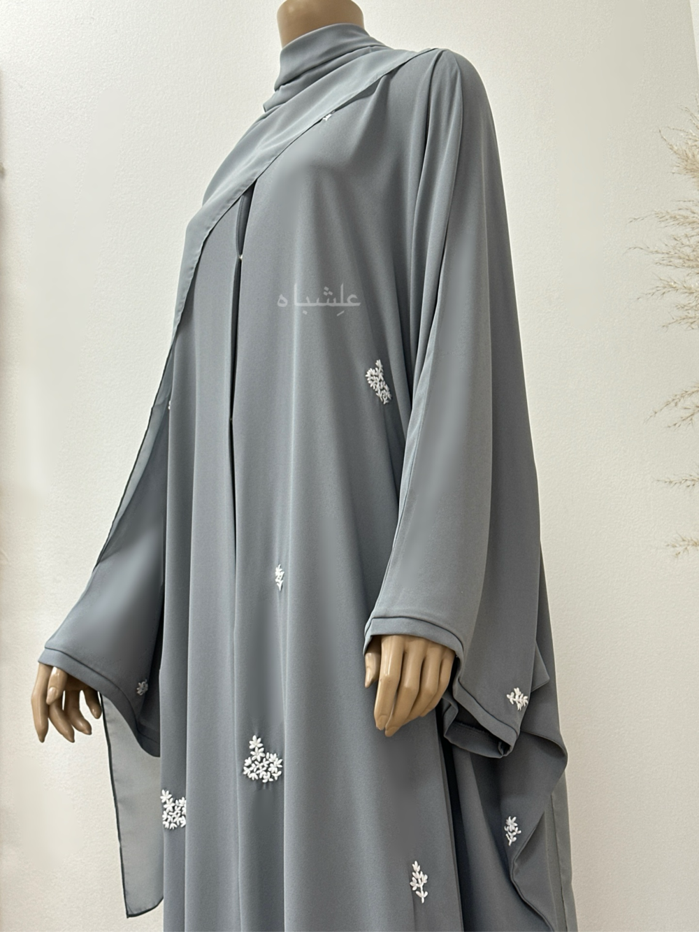 "Egyptian Crape Abaya by Alishbah with Farasha pattern, featuring wide, billowing sleeves that mimic butterfly wings, crafted from lightweight crape fabric for elegant and graceful movement."