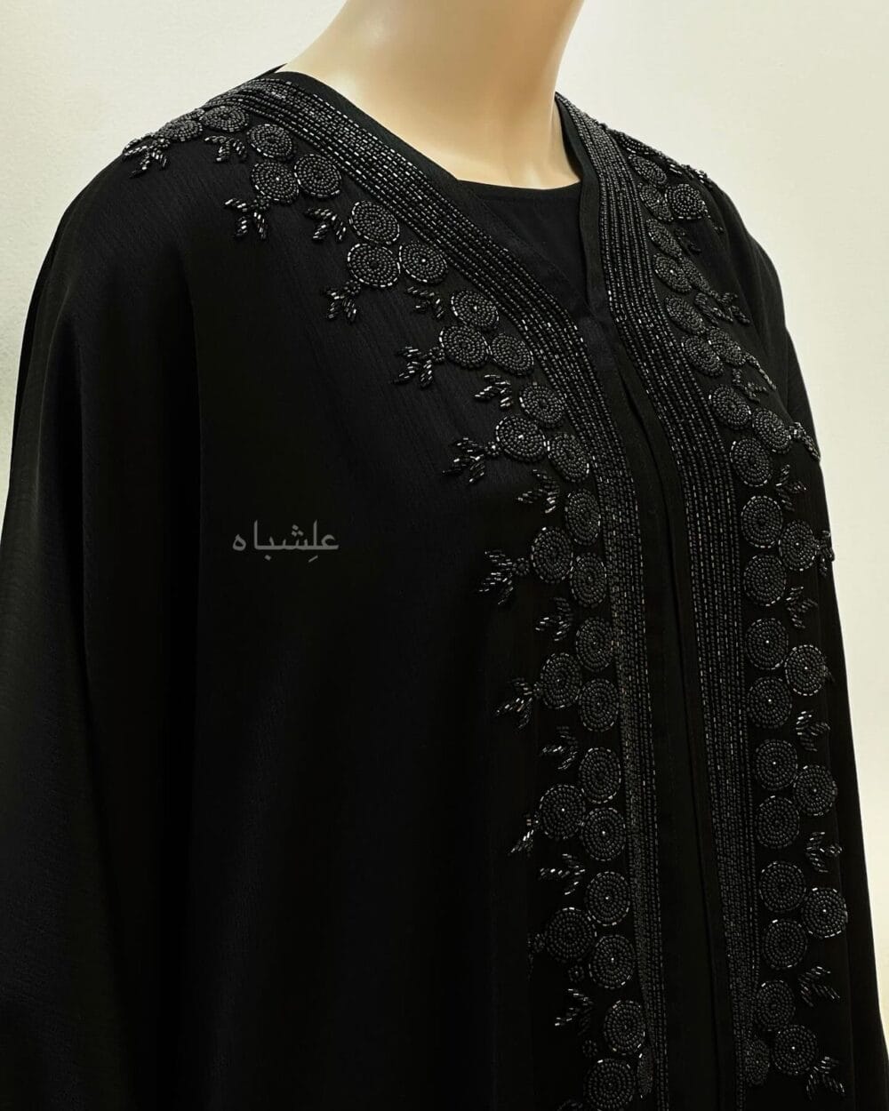 "Close-up of Tranquil Elegance Abaya from Alishbah, showcasing delicate handwork on Zoom New fabric."