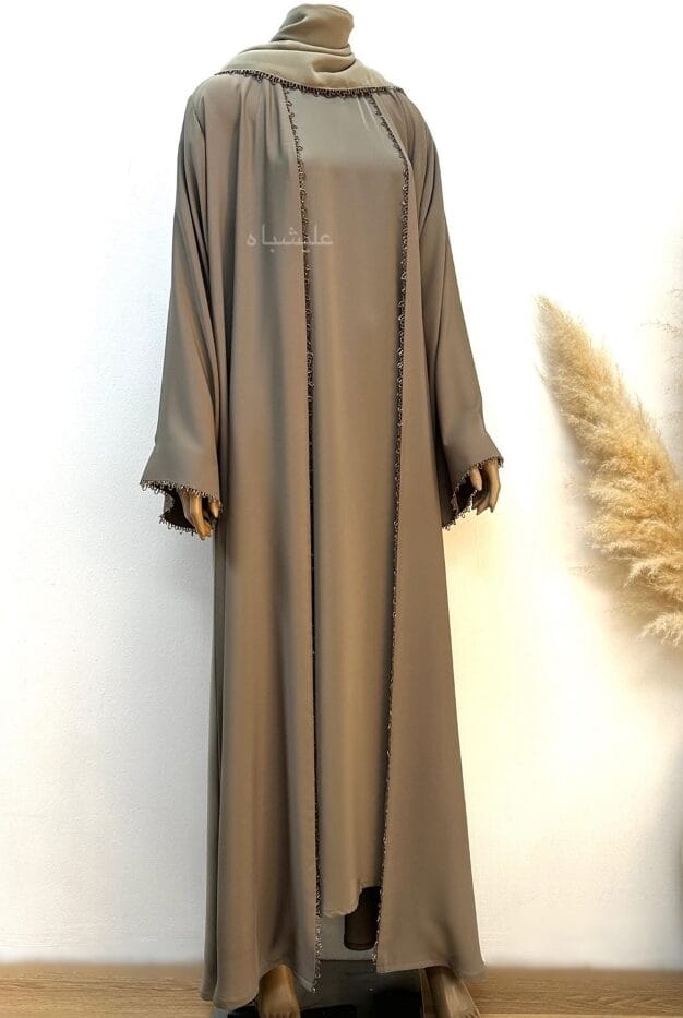 Front full view of abaya showing the inner and outer abaya with handwork on sheila sleeves and center of the abaya