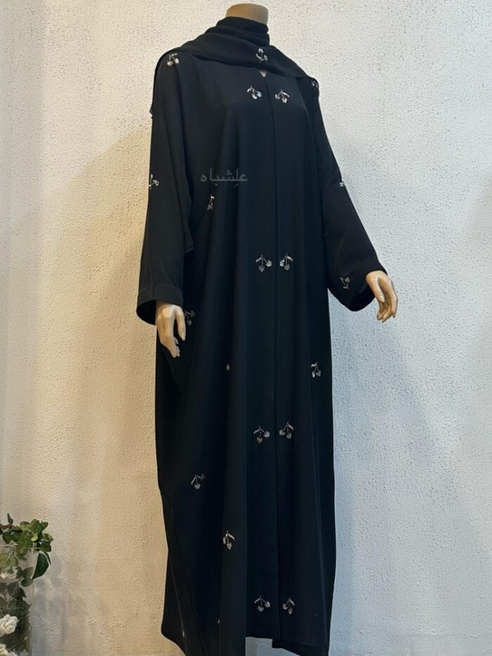 Front view of abaya with sheila with hands raised high