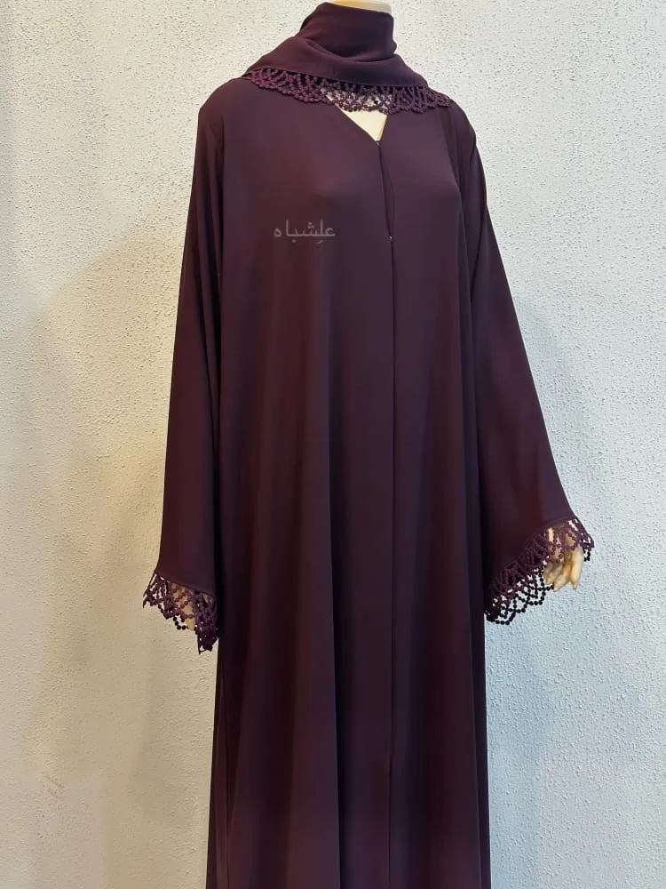Midnight Lace Abaya by Alishbah 1 Front close-up view of abaya with sheila with hands raised little higher