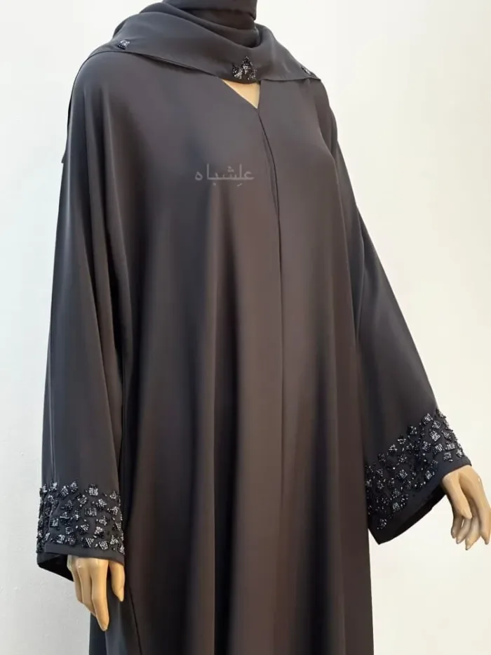 Front side view of abaya with sheila with hands raised slightly higher