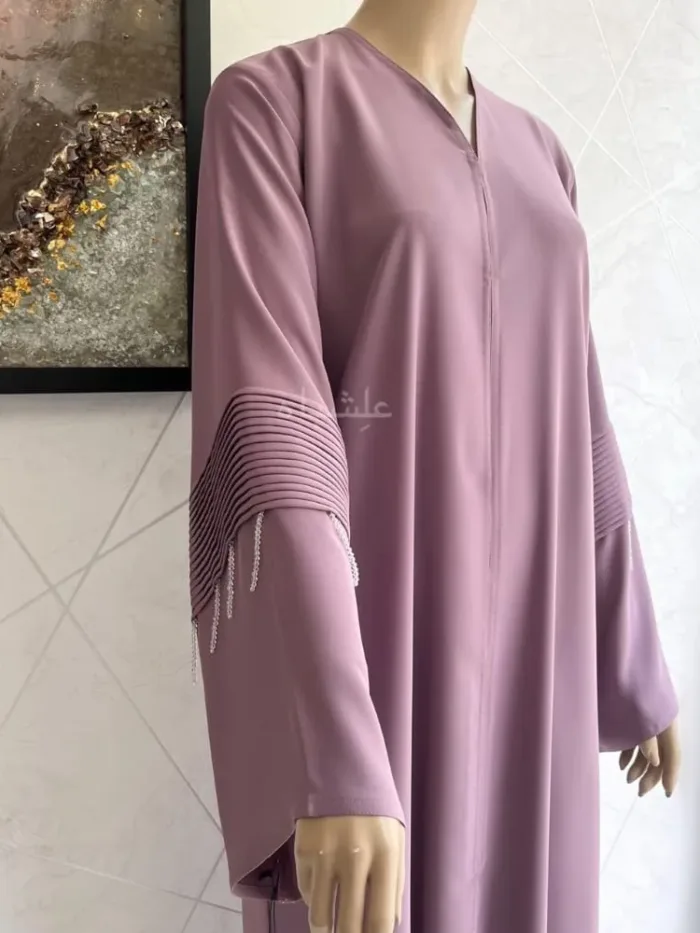 FRONT CLOSE UP VIEW OF ABAYA WITH HANS RAISED HIGHER
