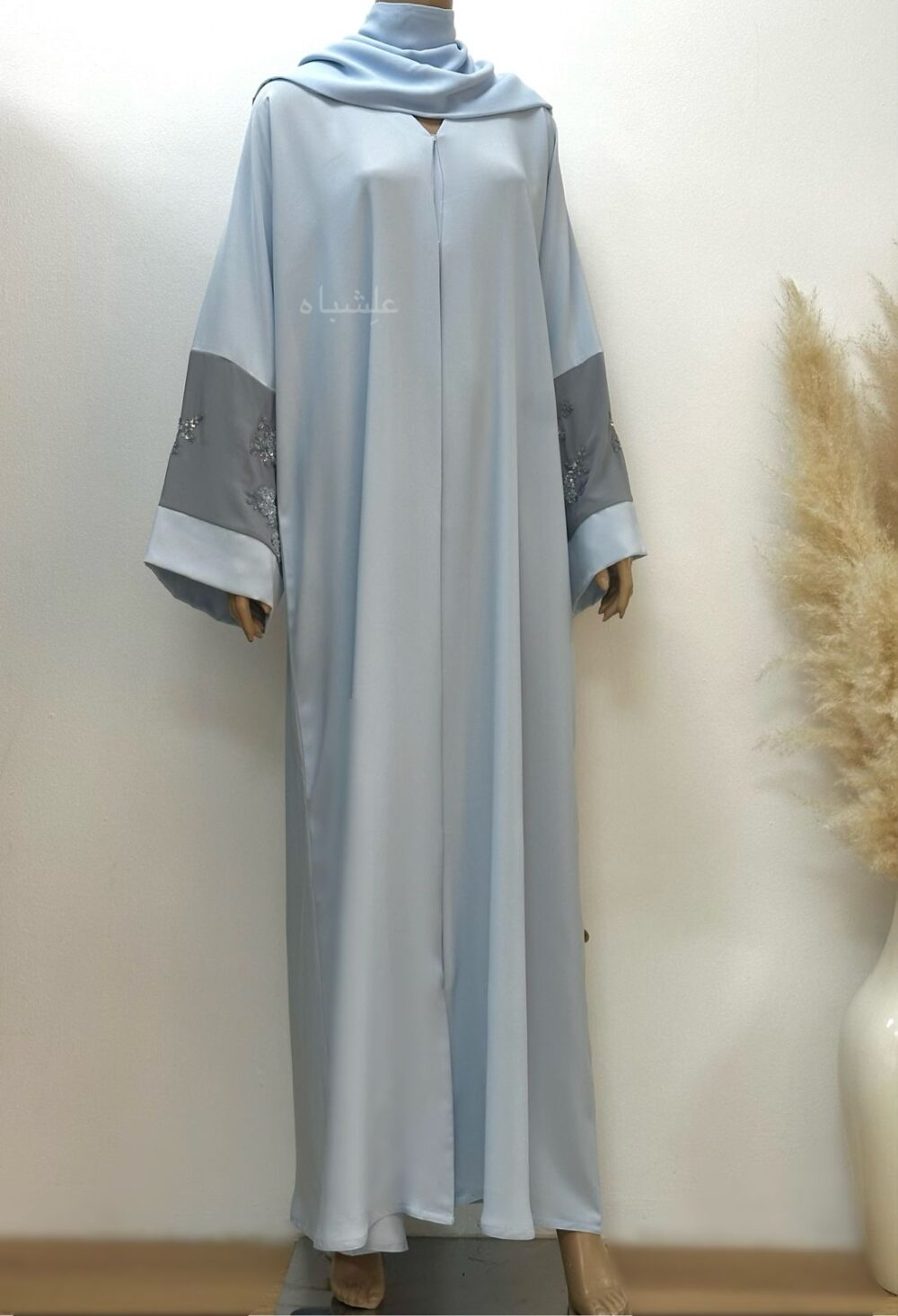 Fron full view of abaya with sheila showing the handwork on both sleeves