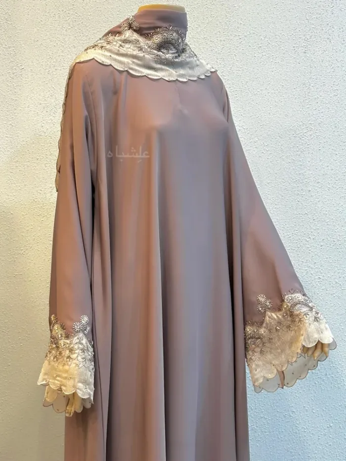 Front view of abaya with one hands raised high
