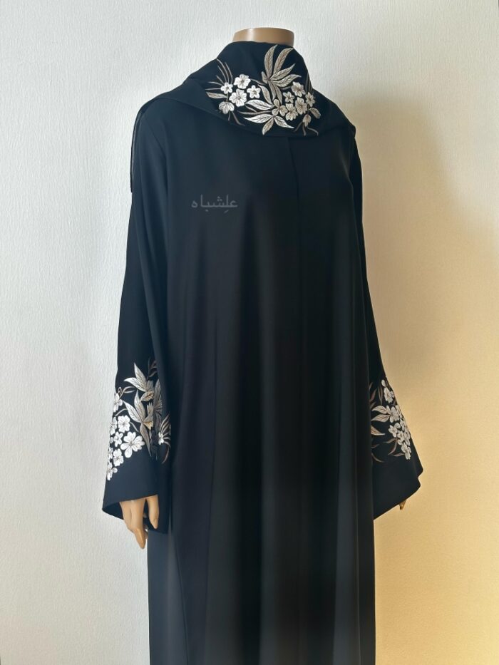 Front view of with embroidery on sleeves and sheila