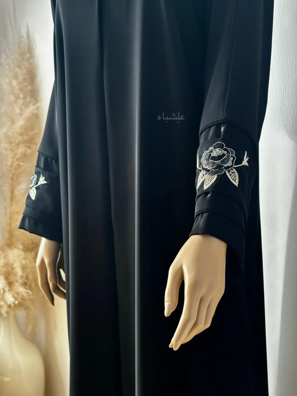 View of rose handwork on sleeves