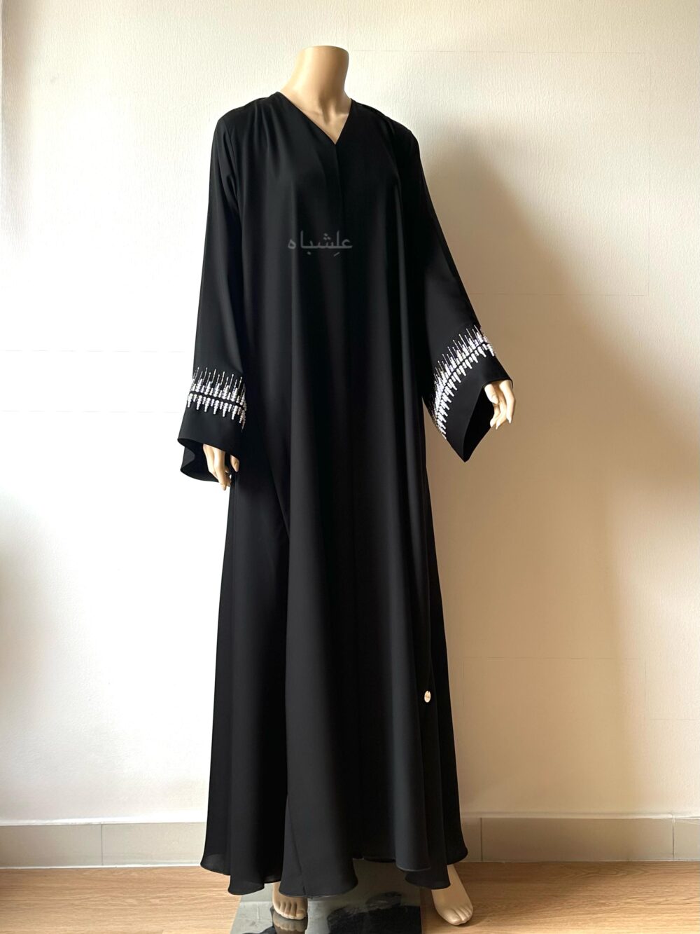 Front view of abaya without sheila with hands raised higher