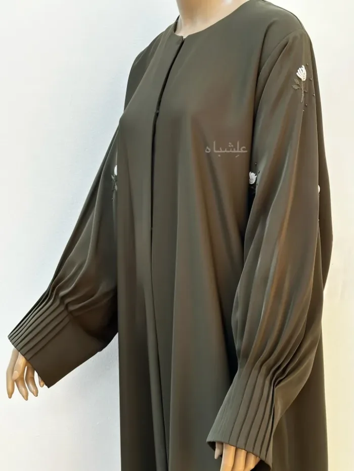 Side view of abaya without sheila with both hands raised higher