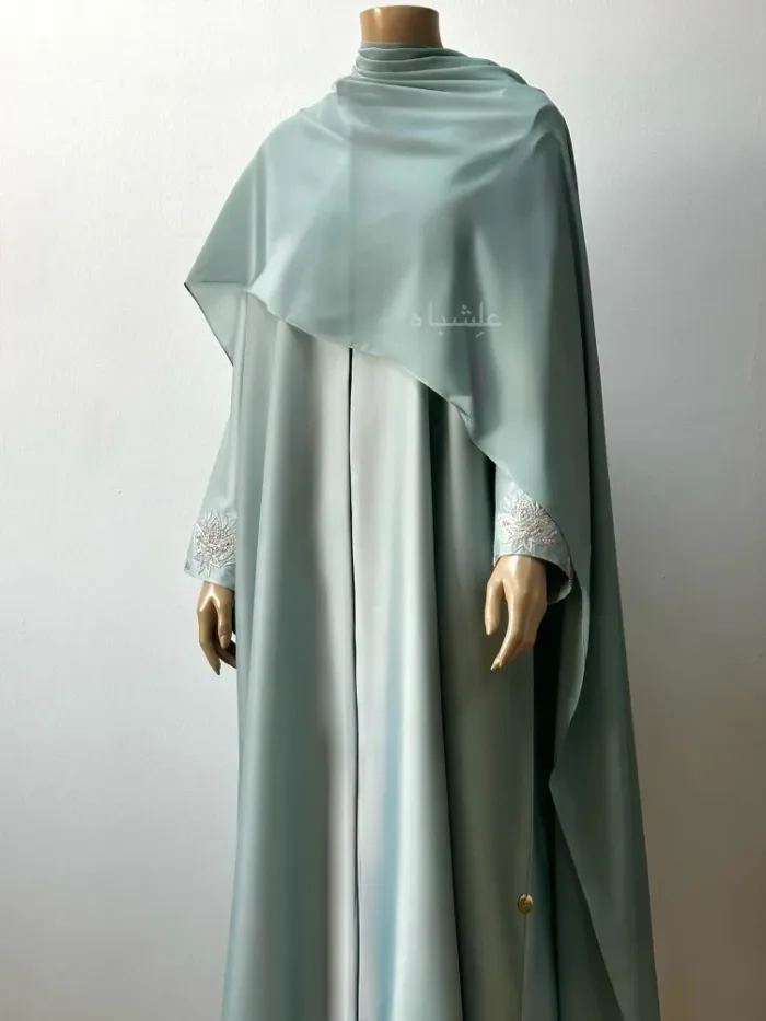 Front shot of abaya with sheila spread all over
