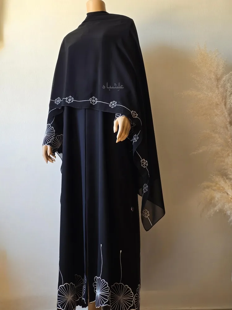 Front view of the abaya with sheila spread all over the abaya front showing the embroidery on long side of the shiela