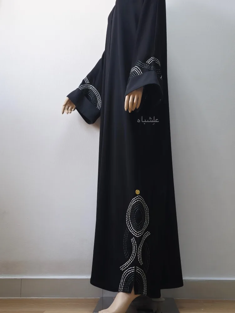 Whisper Waves Abaya 3 Side view of abaya with 2 hands raised