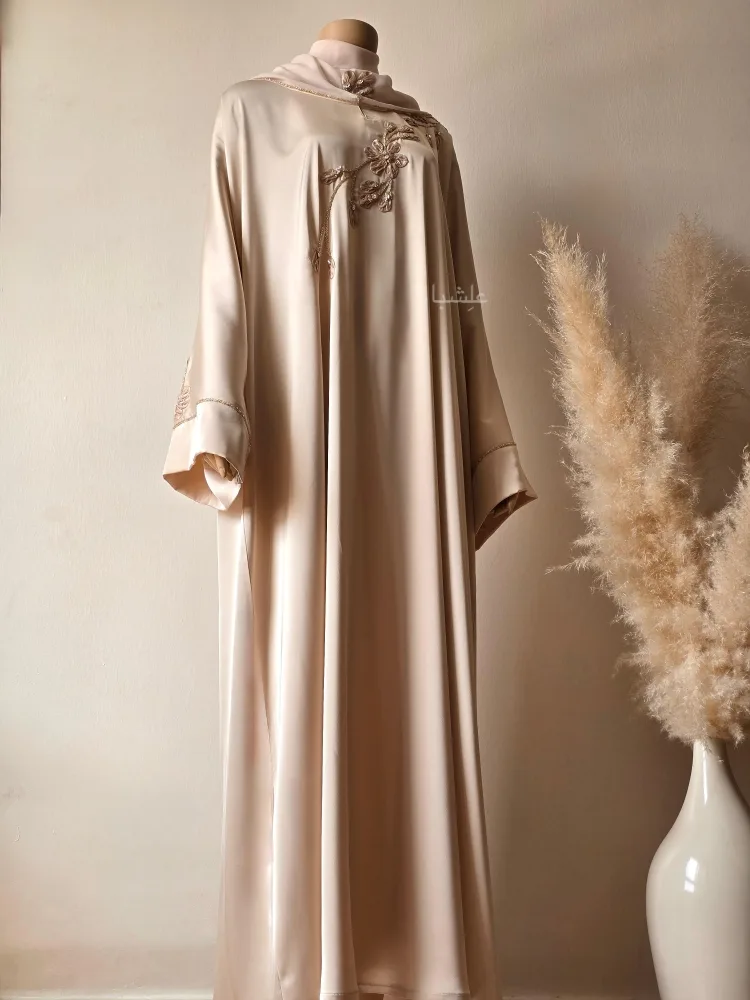 How to Dress Modestly as an Expat in the Middle East | Alishbah Abaya 13 Full front view of the abaya next to pampers with sheila showing the full view of abaya placed on the mannequin with a slight side angle