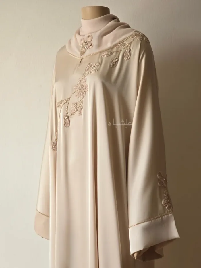 Front kind of a side view of abaya with sheila showing the work on the front of the abaya and the work on the sheila