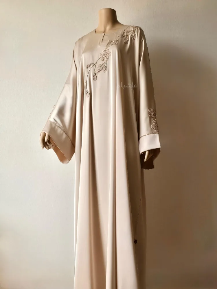 How to Dress Modestly as an Expat in the Middle East | Alishbah Abaya 14 Front full view of abaya without sheila with one hand raised higher