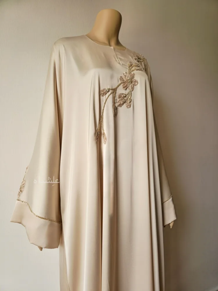 How to Dress Modestly as an Expat in the Middle East | Alishbah Abaya 15 Front close up view of abaya wihtout sheila showing the handwork on front of abaya from a slightly different angle