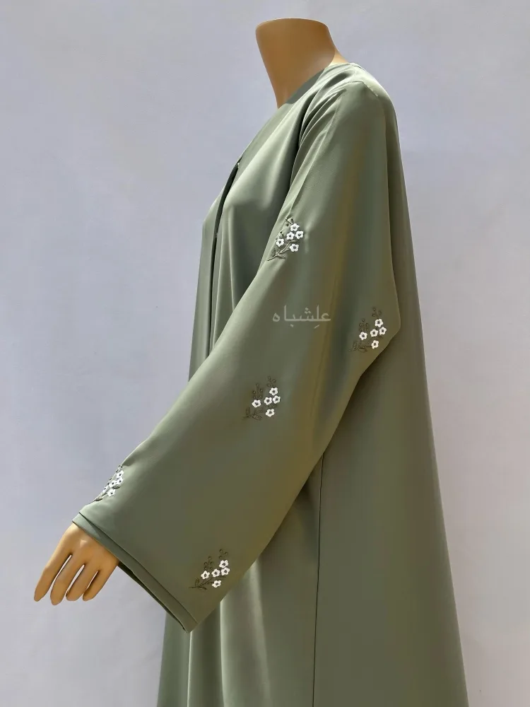 Mint Breeze Abaya by Alishbah 2 Close up view of overall work on sleeves to shoulders