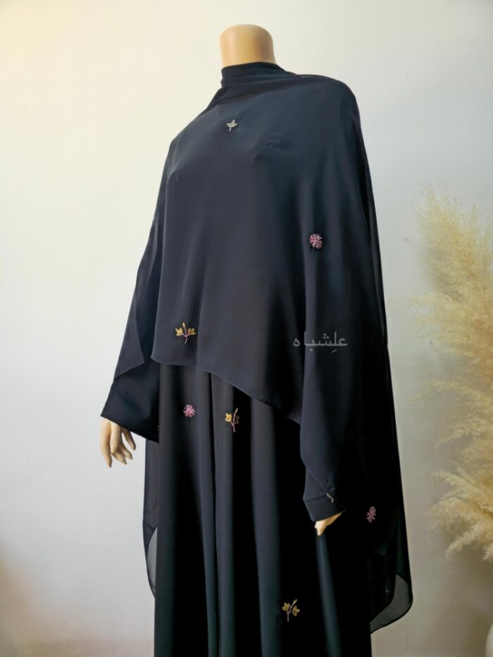 Front view of abaya with sheila spread all over from a different angle