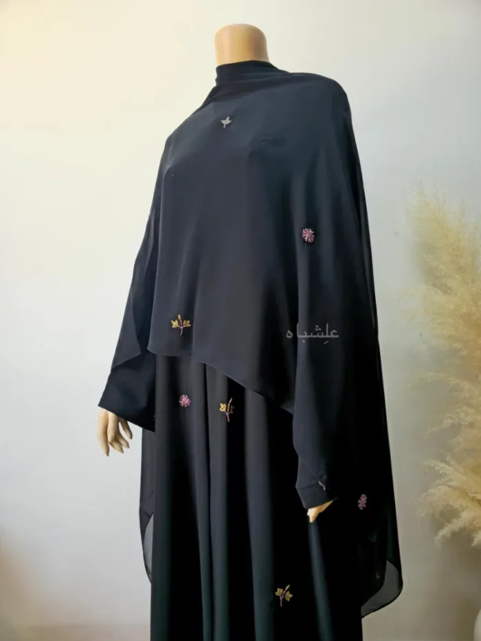 Front view of abaya with sheila spread all over from a different angle