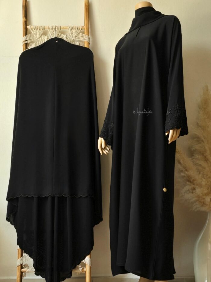 Front view of abaya with khimar on stand