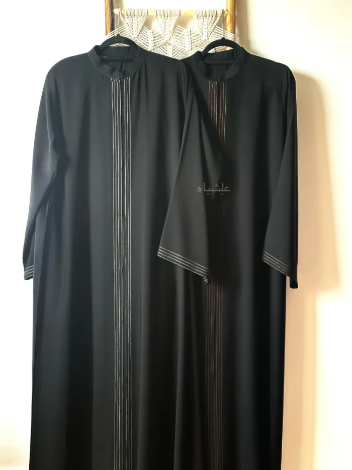 Front view of both abaya on ladder