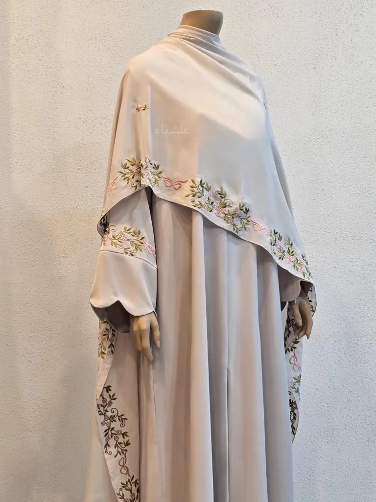 How to Dress Modestly as an Expat in the Middle East | Alishbah Abaya 10 Front close-up view of abaya with sehila spread all over front of the abaya