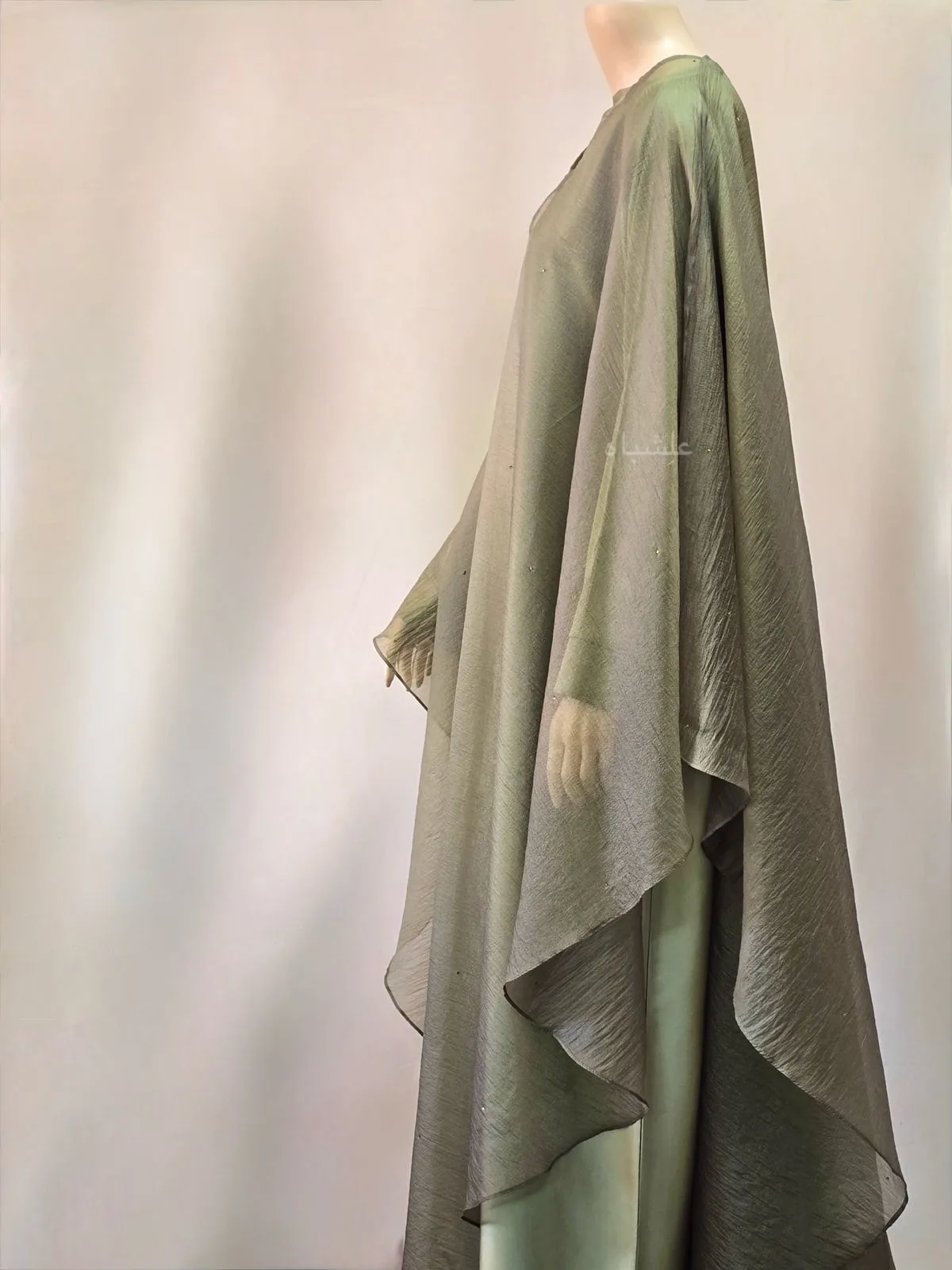 Soft Gleam Cape Abaya by Alishbah Abaya 3 Side view of green abaya