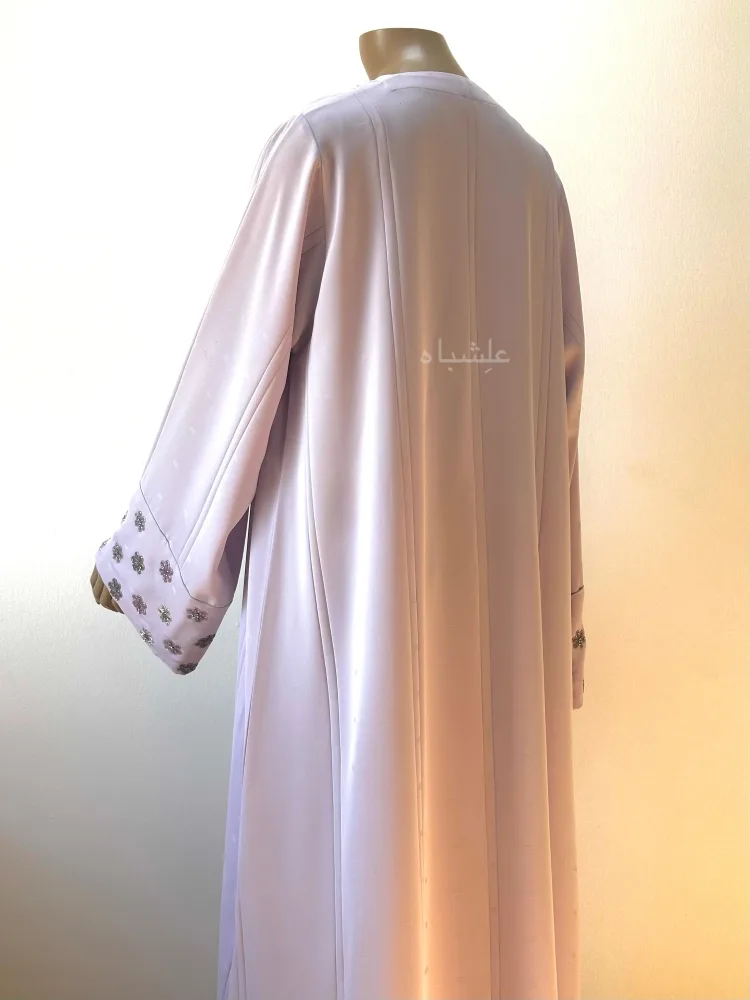 Abaya Sahar al-Layali — The Whisper of Night Blooms 4 Back view of abaya with one hand raised higher