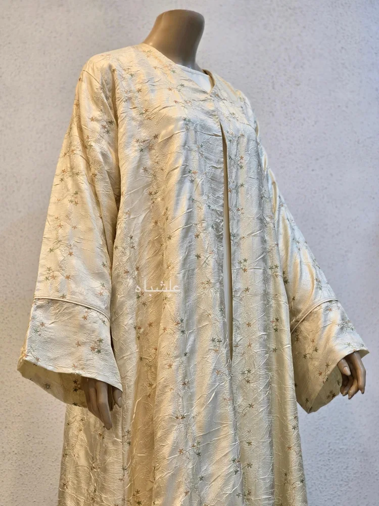 Garden of Layali – Champagne Gold Abaya by Alishbah 4 Front view of abaya without sheila with one hand raised higher