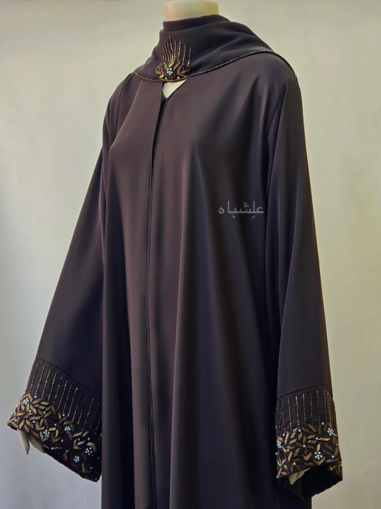 Best Abaya Colors for Different Skin Tones (Europe, USA & Global Guide) 5 Front close up view of abaya with sheila with one hand raised higher