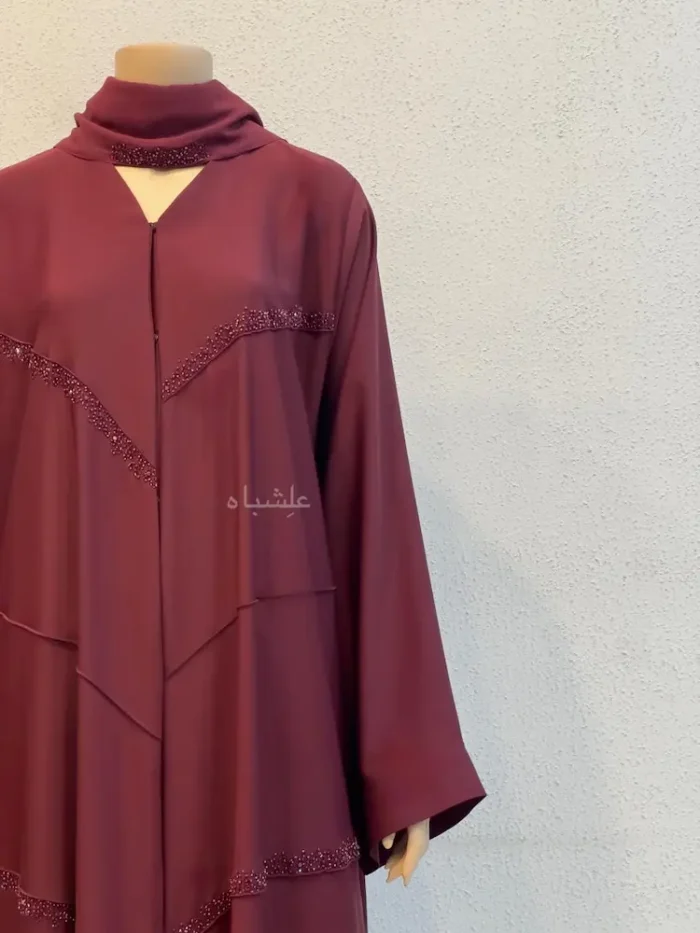 maroon nida abaya bead trims close-up