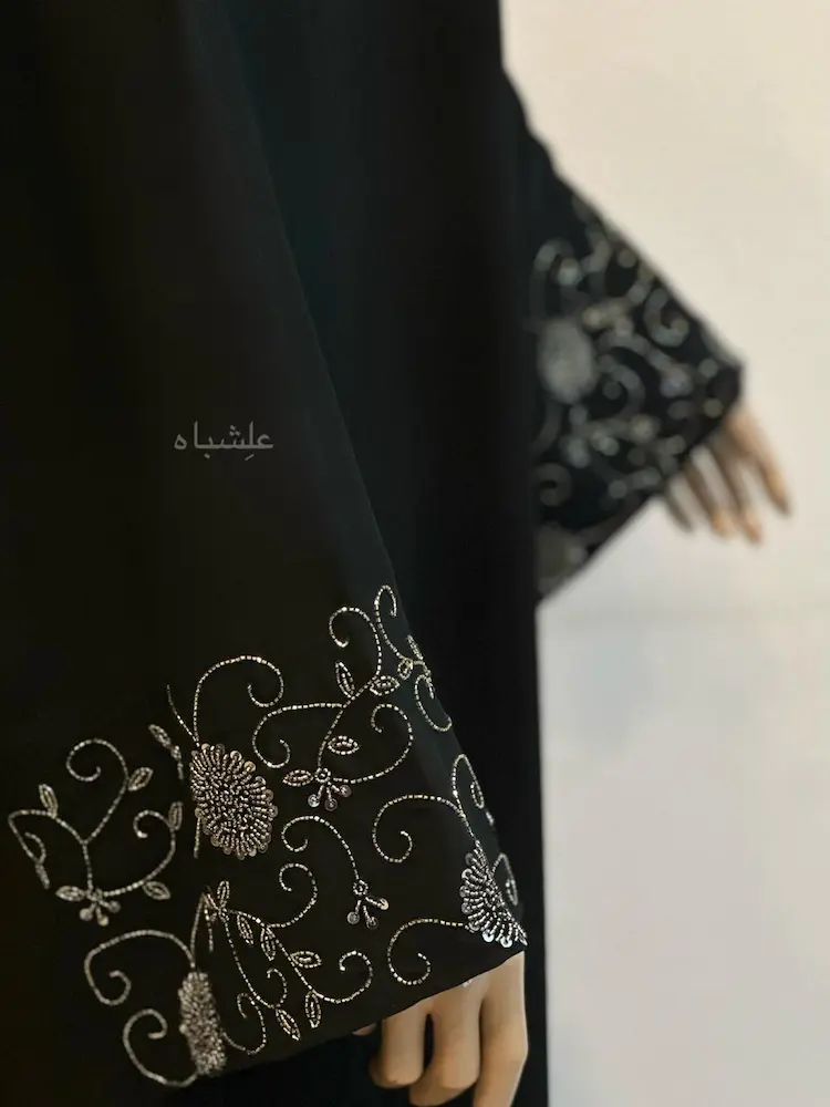 Noor Al-Sukut Handcrafted Minimal Abaya 1 Noor Al-Sukut Abaya with beaded sleeve cuffs