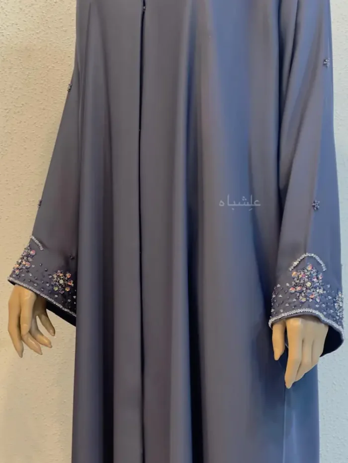 floral handwork on purple nida abaya sleeves