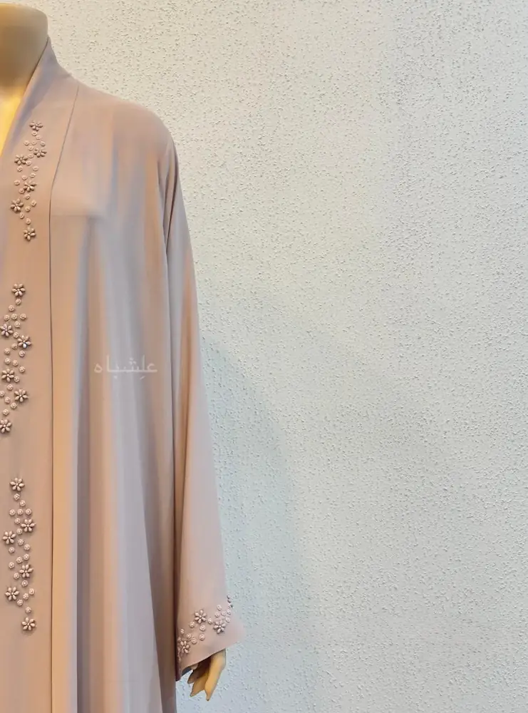 Half view of the abaya showing the half part work of the abaya